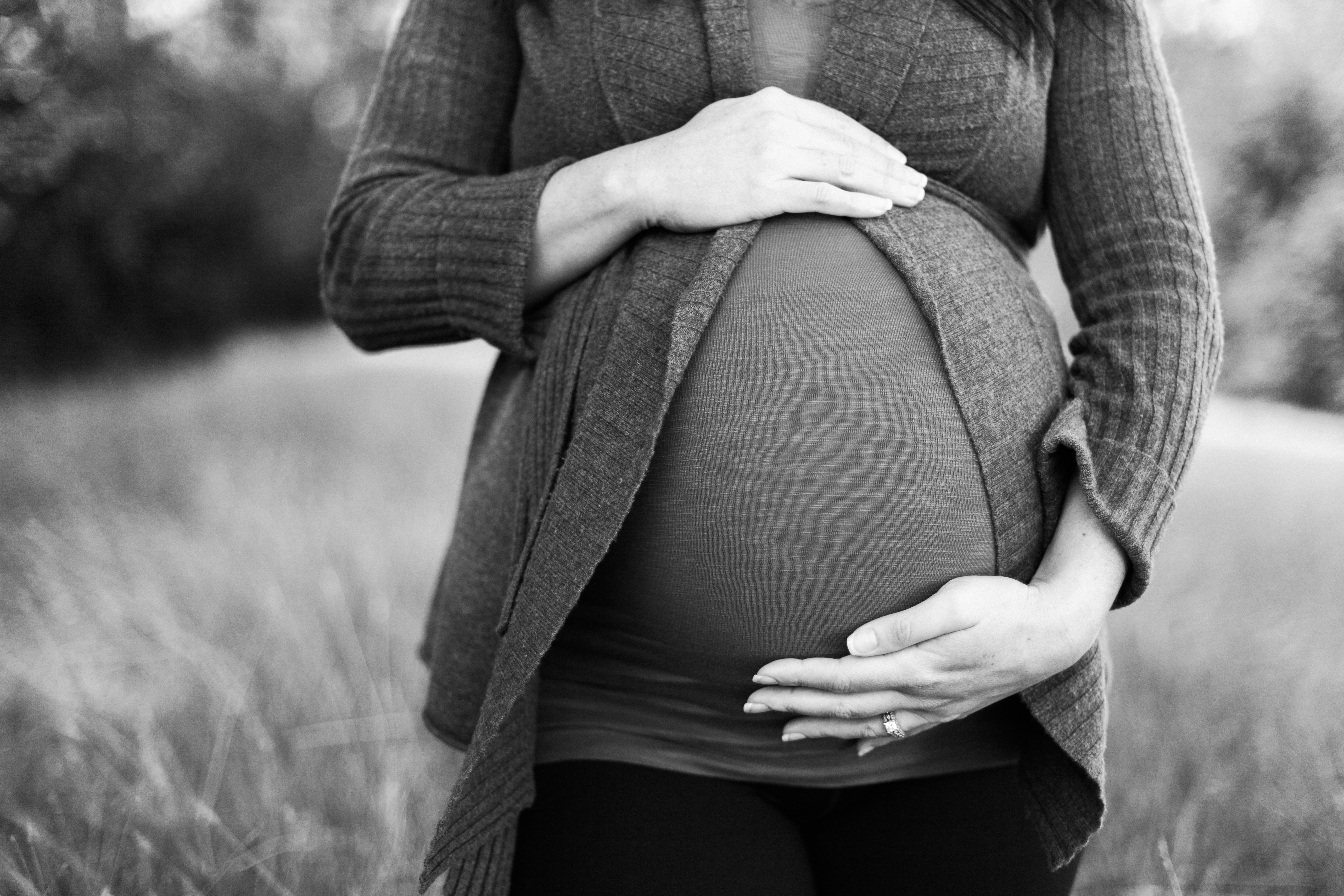 Black and white photo of pregnant woman
