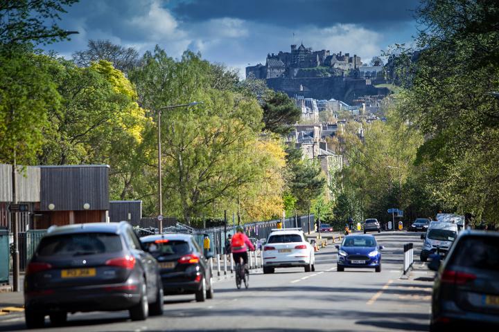 Vehicles and a cyclist in central Edinburgh