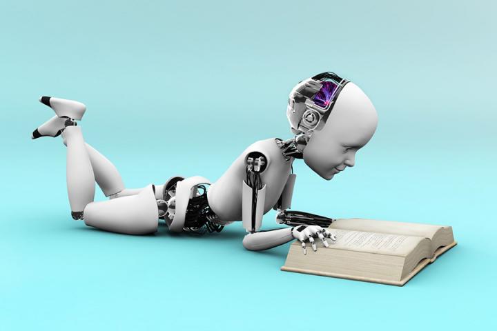 Photo of a robot reading a book
