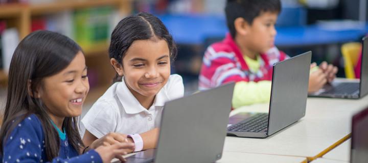 Children having fun using computers