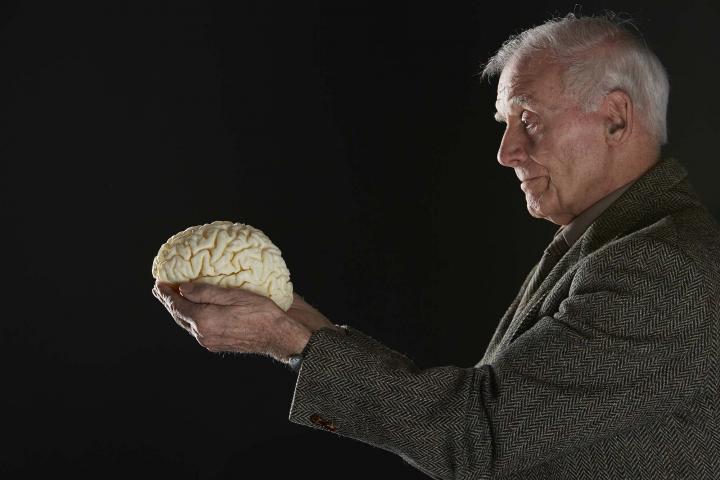 Lothian Birth Cohort participant John Scott with a 3D printed model of his brain