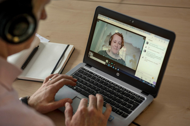 online learning student talking to teacher via webcam