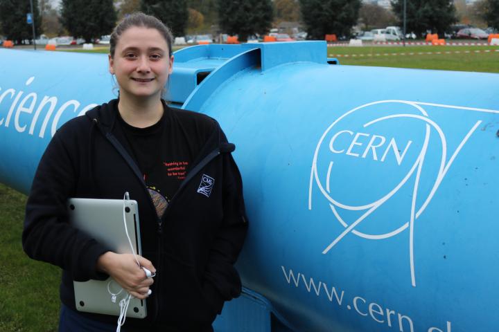 Elena Villhauer, second-year PhD student on the ATLAS experiment, standing outside CERN.