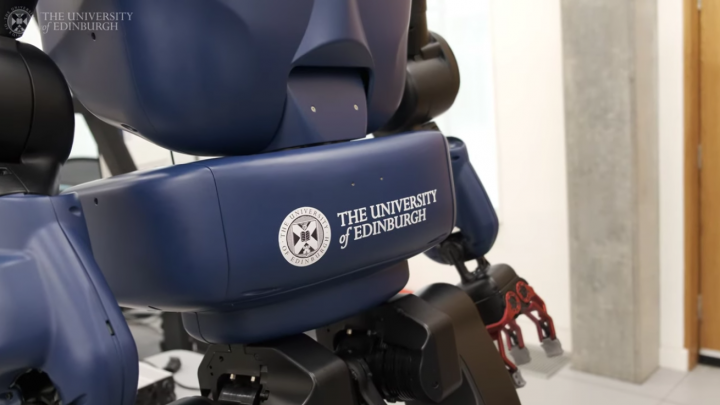 close up shot the university of edinburgh logo on a blue robot