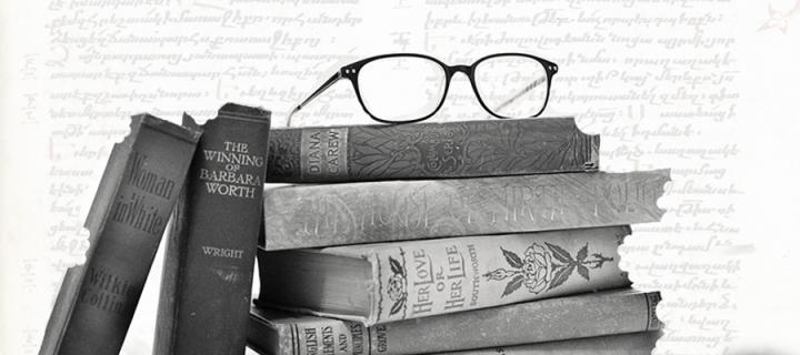 Glasses on a pile of books
