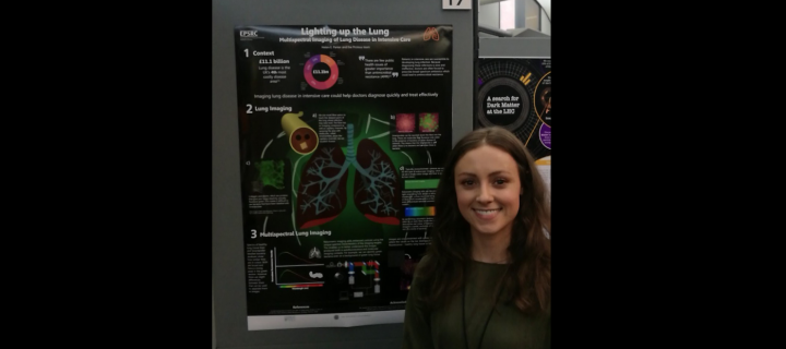 PhD student Helen Parker stands next to her winning poster at the STEM for BRITAIN showcase