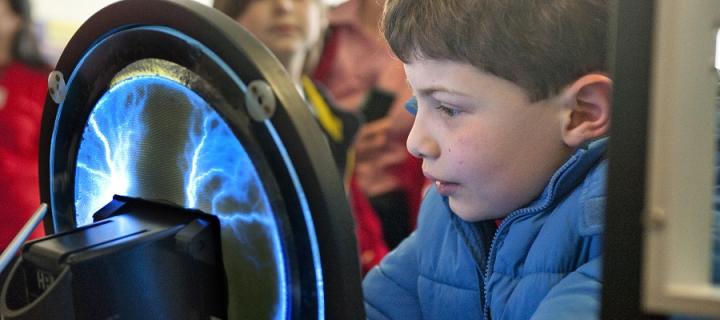 A boy looks at an exhibit at the Edinburgh Science Festival