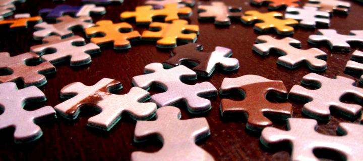 Image of jigsaw puzzle pieces on a table
