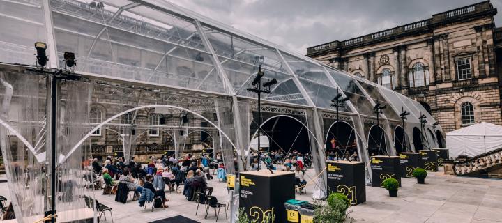 Large clear gazebo set up and hosting Edinburgh International Festival on campus. 