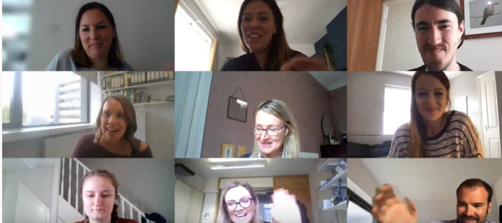 Photo of team smiling on video call