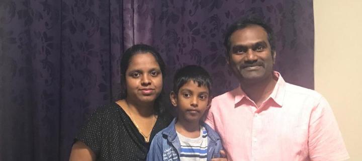 Durai and his wife and son smile for the camera