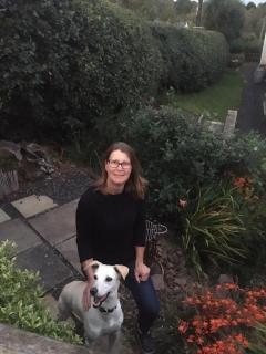 Professor Lonneke Vervelde in a garden with her dog