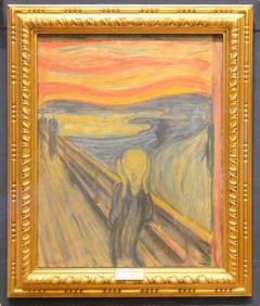 Photograph of Munch's The Scream painting in a gold frame. 