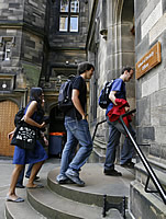 Students enter a building at New College