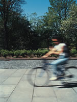 M 090424 Savings for staff with Bicycles+ Person riding a bicycle in George Square