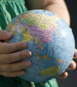 Child holding a globe