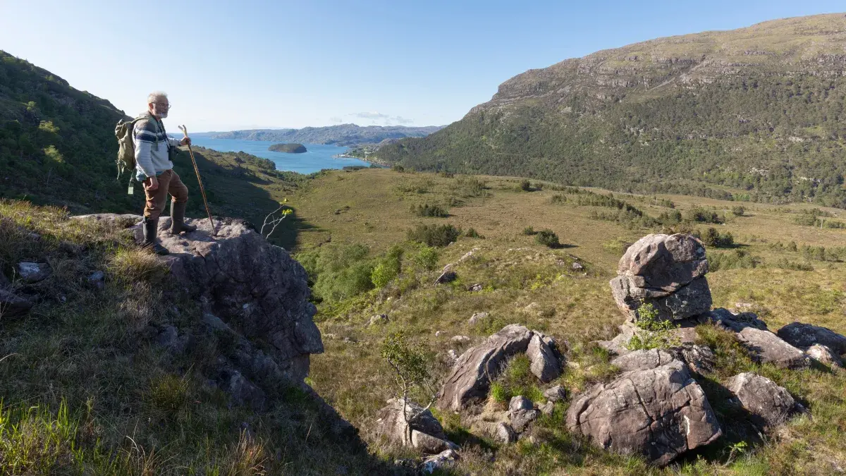 Richard Munday, Convenor of the Kinloch Woodlands SCIO, looking over land at Kinloch Woodlands in Shieldaig