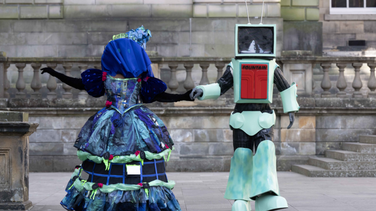 Two students pose in costumes created for the 2025 Performance Costume Show. (L-R) The Winchester Ghoul and Ad-bot