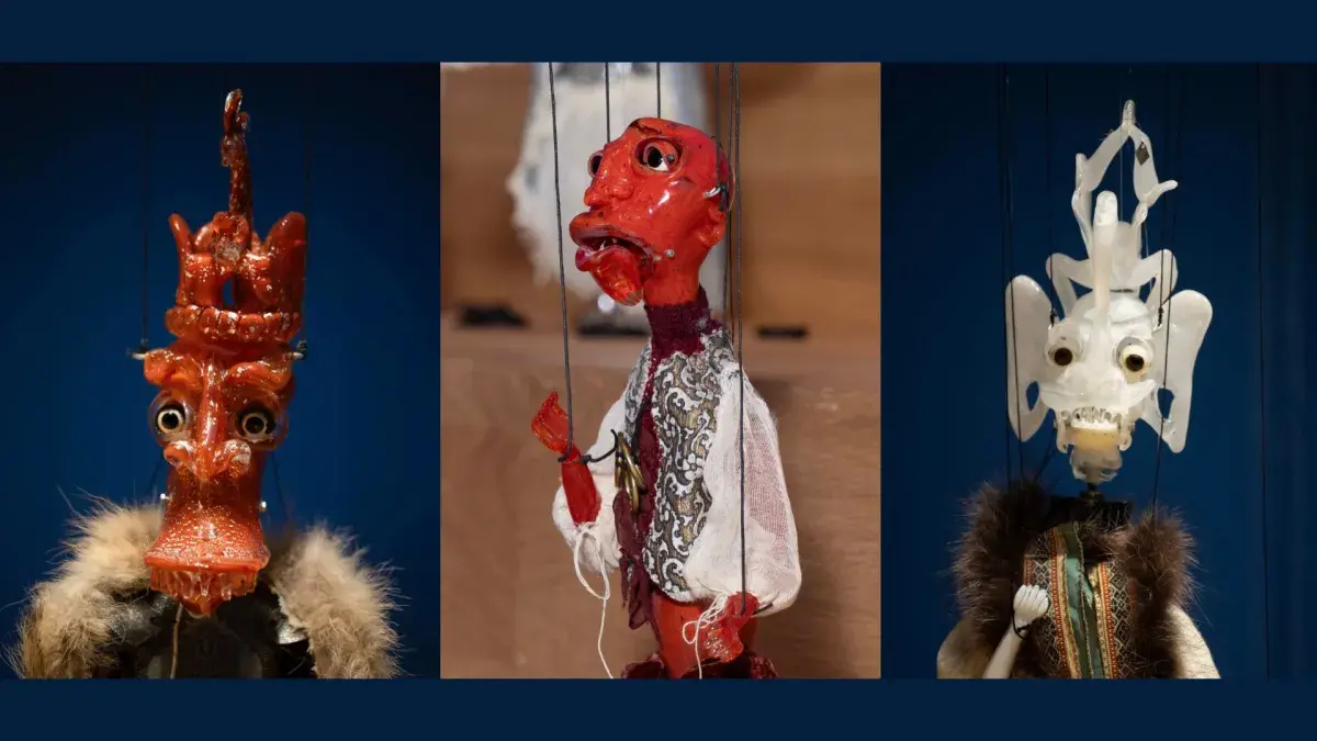 Three hand-sculpted glass puppets in close-up.