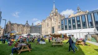 Festival goers enjoy the International Book Festival site at the Edinburgh Futures Institute. 