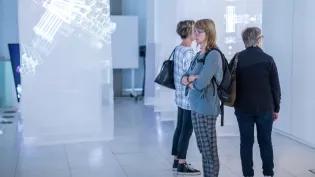 Visitors explore a digital exhibition at the University's Inspace gallery. 
