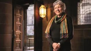 Mary Hepburn standing in the Old Medical School