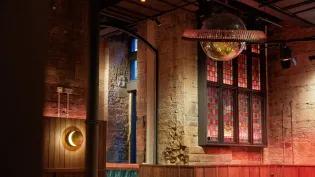 Interior detail of the new Union Social bar with stained glass and disco balls