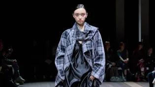 A model walks down the catwalk showcasing an ECA students design