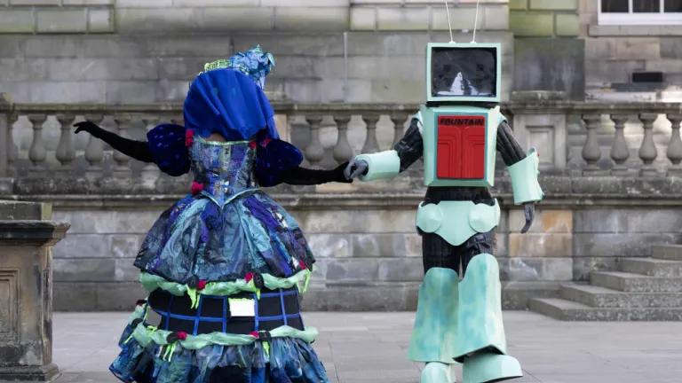 Two students pose in costumes created for the 2025 Performance Costume Show. (L-R) The Winchester Ghoul and Ad-bot