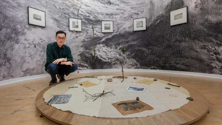 Artist Kang Seung Lee pictured with his installation at Talbot Rice Gallery