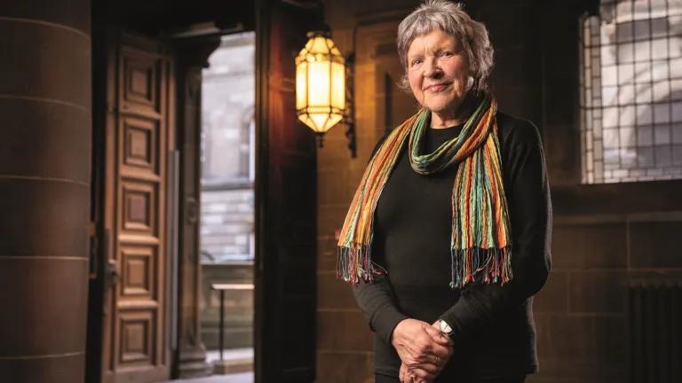 Mary Hepburn standing in the Old Medical School