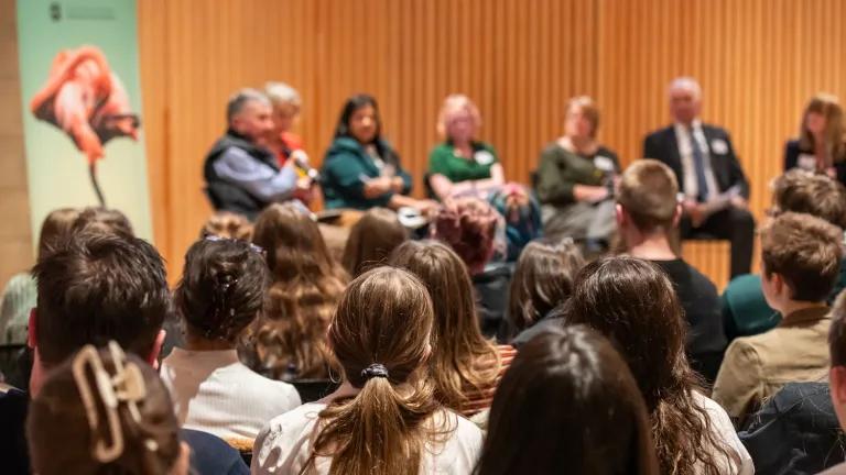image from the back of an audience of school pupils at a hustings event with councillors from across Edinburgh