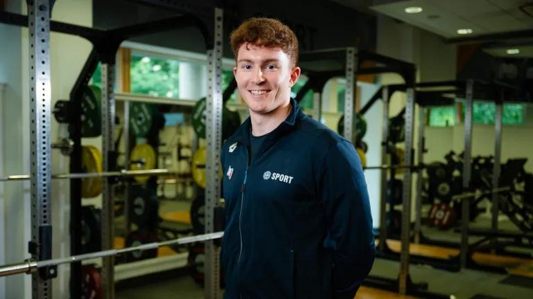 Swimmer Archie Goodburn poses in the University gym