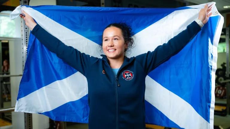 Weightlifter Maddie Rocher poses with a Saltire flag. 