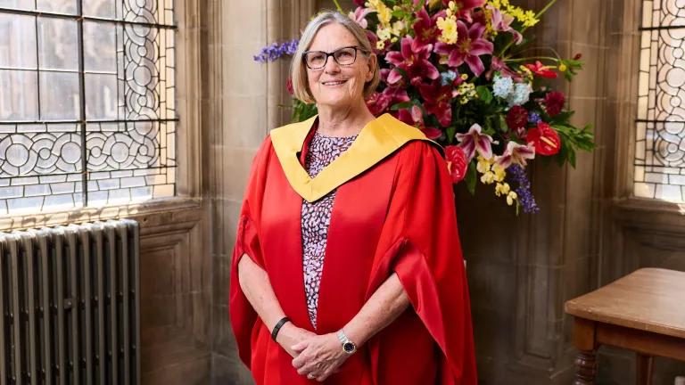 Dr Kathy Sullivan standing in graduation robes at McEwan Hall, 2026