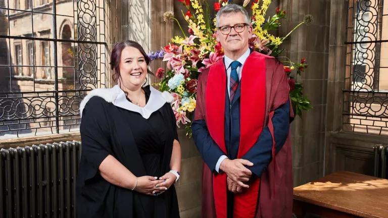 Being Edinburgh award winner Sabrina Tickle (L) standing with Chris Cox, Vice-Principal Philanthropy and Advancement (R) during a 2026 summer graduation ceremony at the University of Edinburgh
