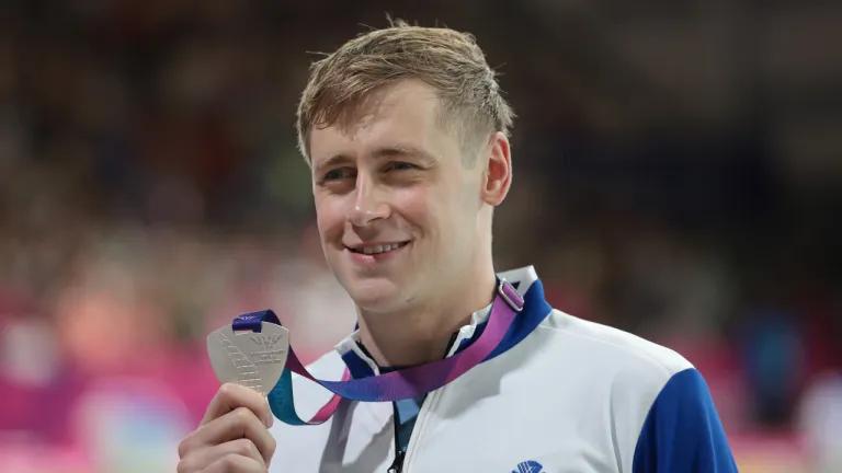 Para swimmer Stephen Clegg MBE receives his silver medal