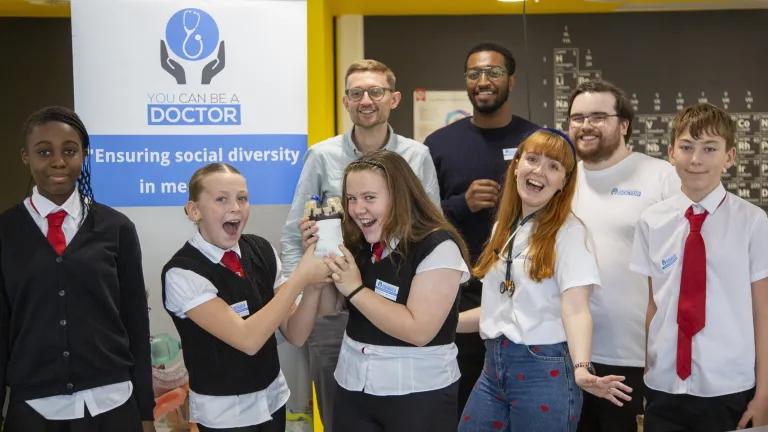 Back L-R Callum Cruickshank (founder of YCBAD) Alsadeg Bilal (MD-PhD Candidate, UofE) and Luc Cummings (Doctor and YCBAD). Front Castlebrae students with Paula Glancy