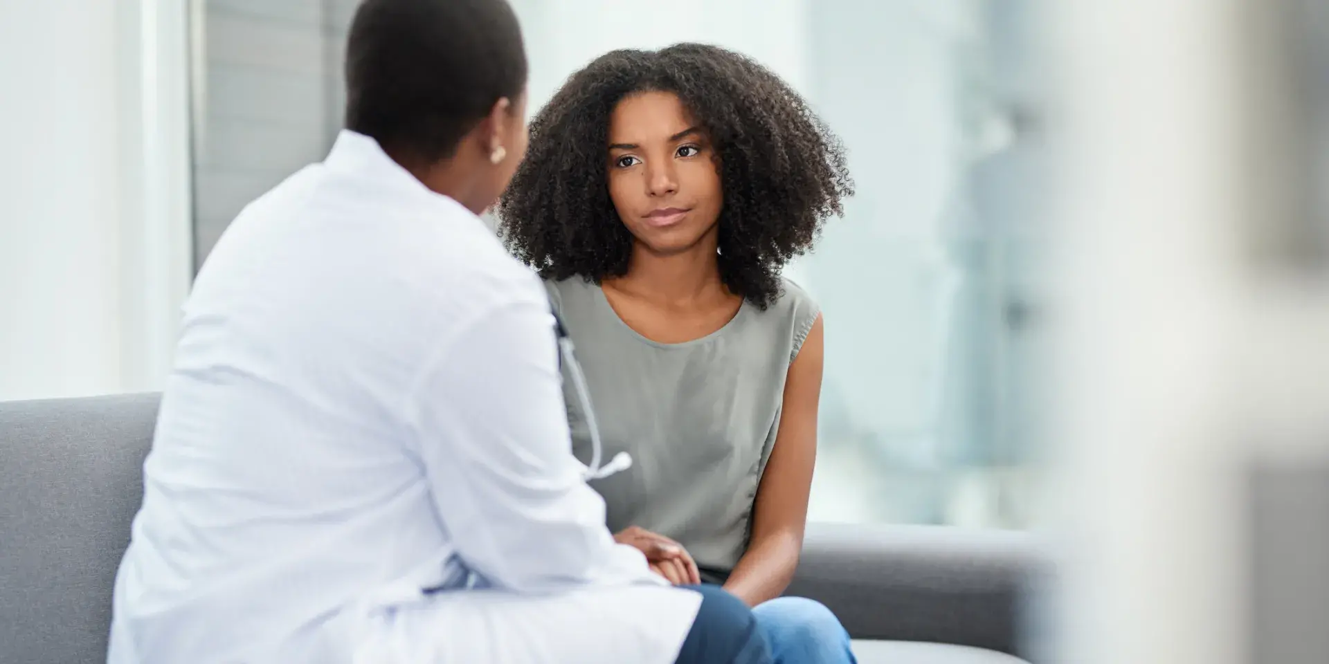 A young woman having a consultation with a doctor