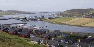 A cluster of houses next to water in Scalloway, Shetland Islands