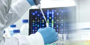 Scientist pipetting sample into a vial for DNA testing