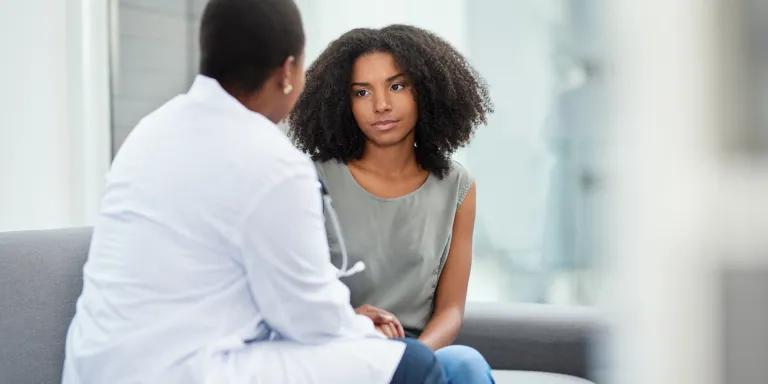 A young woman having a consultation with a doctor