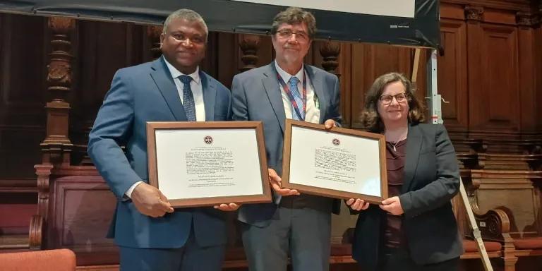  The Hon. Minister of Health, Dr Ahmadou Lamin Samateh, and Professor Umberto d’Alessandro of MRC The Gambia receive their prize from University of Edinburgh Provost Professor Kim Graham