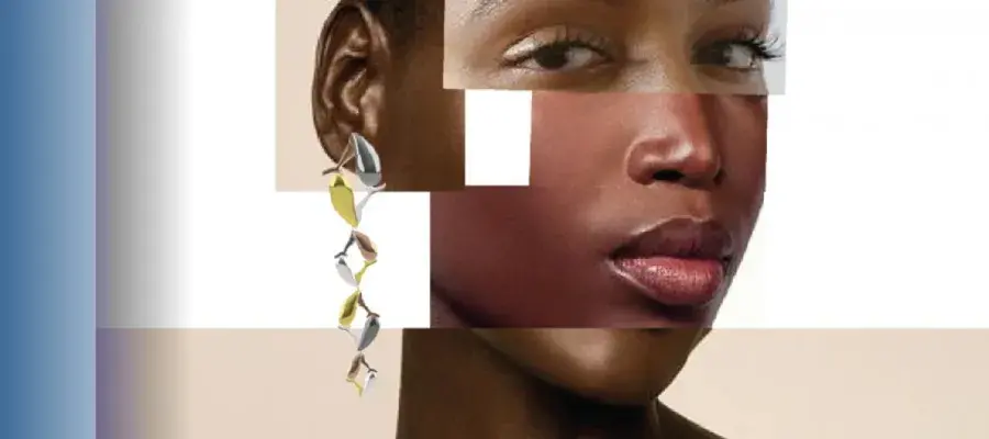 Close up of a face and ear wearing gold and silver earring