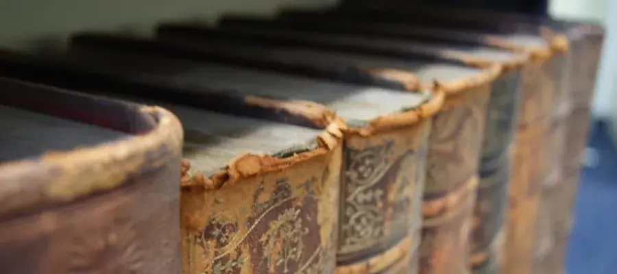 Very old books on library shelf
