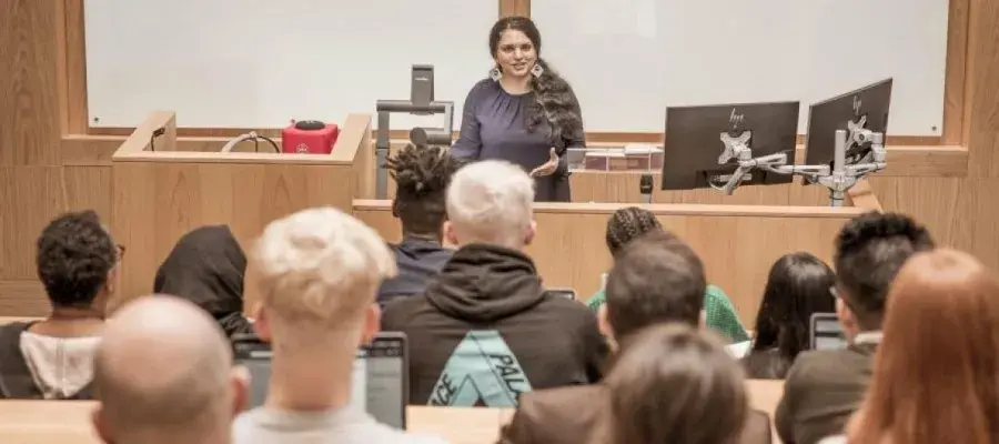 Group of students together watching a university lecture