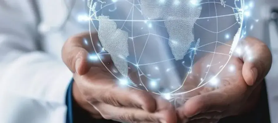 person holding a computer generated globe in their hand