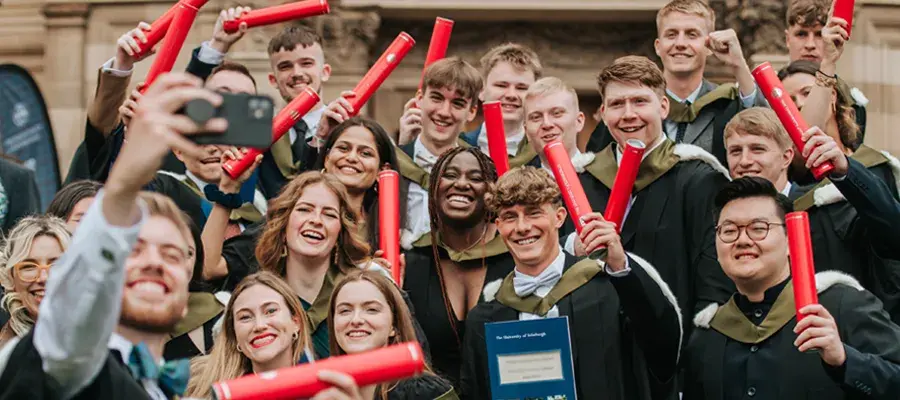 Group of graduates celebrating with big smiles