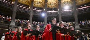Carol singers singing at Christmas Carol Service