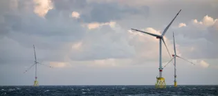 Three wind turbines from an offshore windfarm in the North Sea